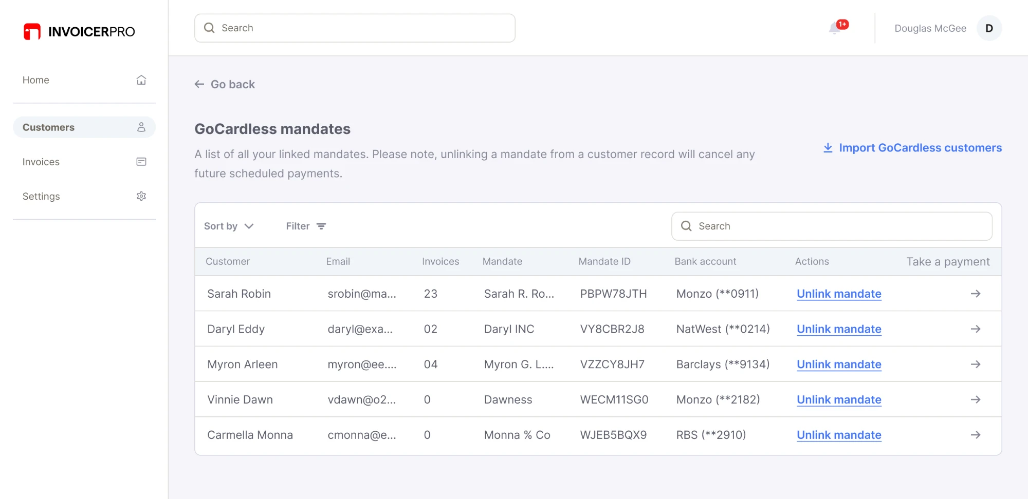 Mandates page listing each linked mandate with its customer, mandate ID and bank account, and an unlink mandate link